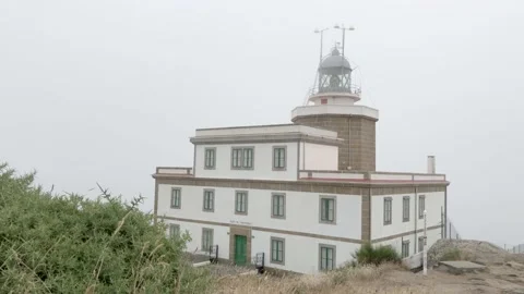 Finisterre Lightouse with foreground vegetation Stock Footage 137906642