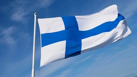 Finland flag with flag pole in super slow motion with beautiful summer sunny sky 動画素材 117357501