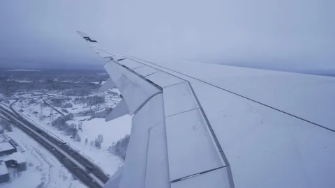 Finnair Airbus A350 Passenger Airplane Approaching Airport before Landing, Snow Stock Footage