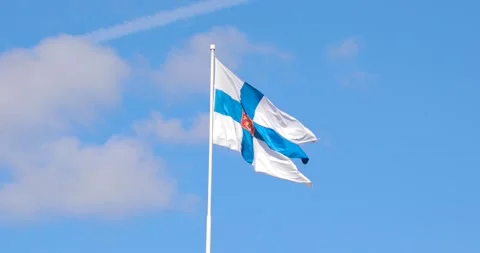 Finnish Defense Forces flag waving against a clear sky Vidéo 210025641