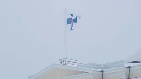 Finnish flag raised over Prime Minister's Office in Helsinki. Stock Footage 186515068
