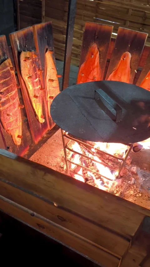Finnish method, Salmon on planks, roasted over an open fire. Stock Footage 323142811