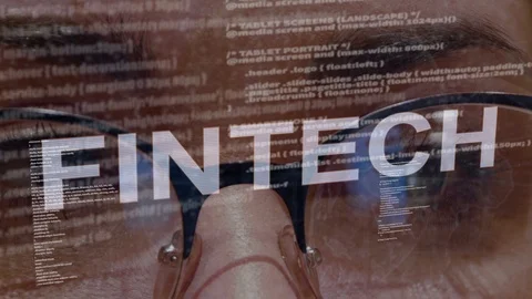 Fintech text on background of female developer Video stock 107201281
