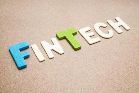 FinTech wording on brown background Stock Photos