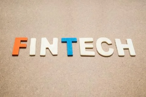 FinTech wording on brown background Stock Photos