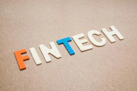 FinTech wording on brown background Stock Photos