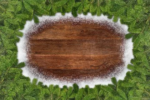 Fir branches frame on wood Stock Photos