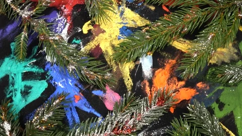 Fir branches sprinkled with silver glitter are on black pattern fabric Stock Footage 282535048