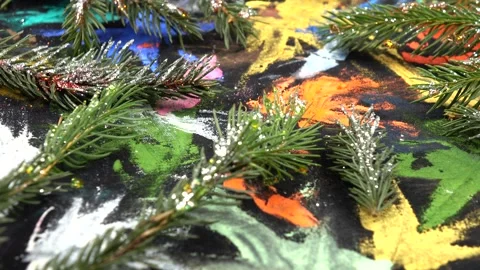 Fir branches sprinkled with silver glitter are on black pattern fabric Stock Footage 282535202