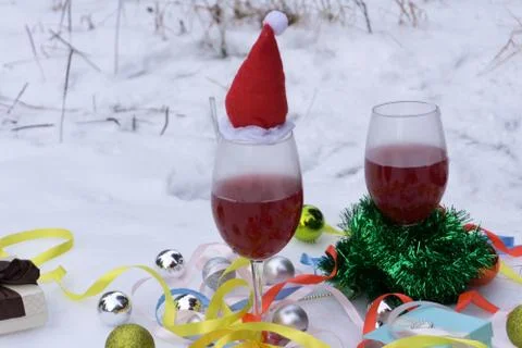 Fir branches, two of red wine on wooden table Stock Photos