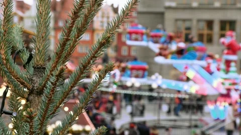 Fir tree and carousel on a decorated Christmas fair on a festive central square Stock-Footage 133397156