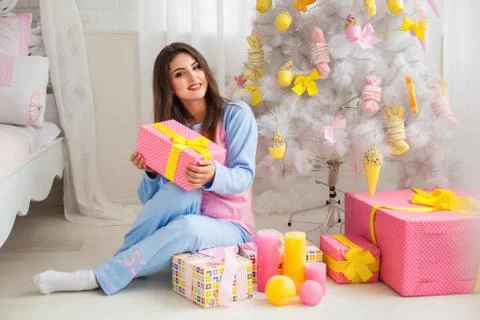 Fir-tree and model with presents Stock Photos
