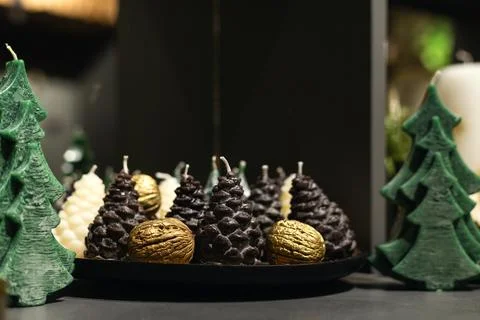 Fir Tree and Pine Cone Shaped Candles on the Table Stock Photos