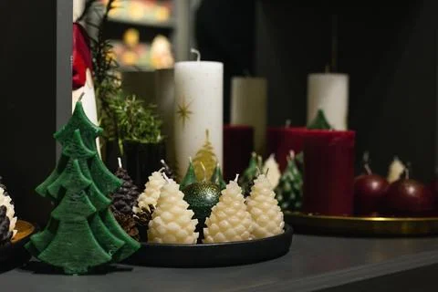 Fir Tree and Pine Cone Shaped Candles on the Table Stock Photos
