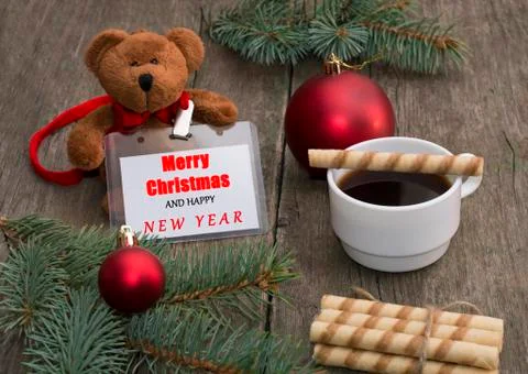 Fir-tree branch, bear, coffee, baking and label with an inscription Christmas Stock Photos