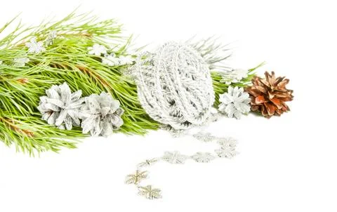 Fir tree branch, silver cones and star garland isolated on white Stock Photos