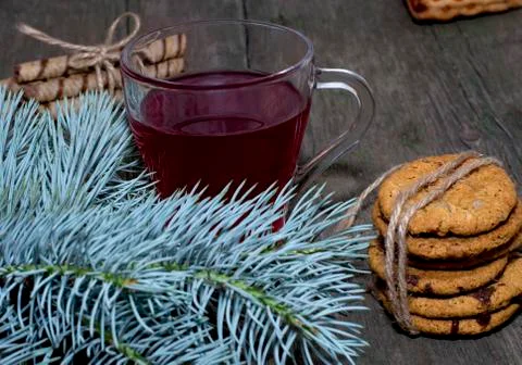 Fir-tree branch, tea and oat baking Stock Photos