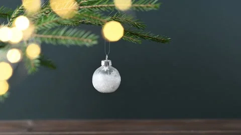 Fir tree branches,  a Christmas tree ornament with a bokeh effect from the ga Stock Footage 322823205