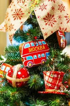 Fir tree decorated with gingerbread in shape of double decker bus (with word  Stock Photos