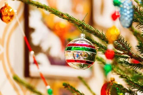 Fir tree decorated with shiny old fashioned balls and light bulbs for Christm Stock Photos