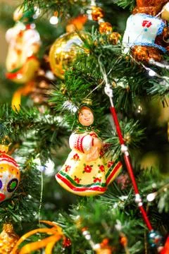 Fir tree decorated with shiny old fashioned toys and light bulbs for Christma Stock Photos