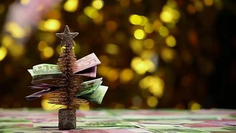 Fir tree money table gold bokeh hd footage Stock Footage 117910540