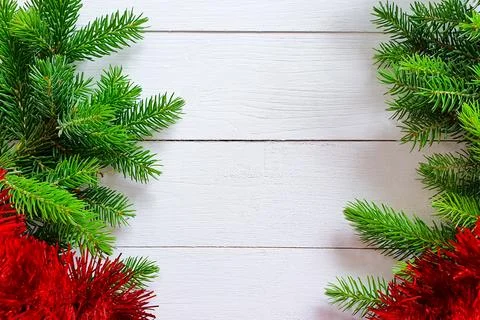 Fir tree pine borders, red garland on white wooden background. Christmas Stock Photos