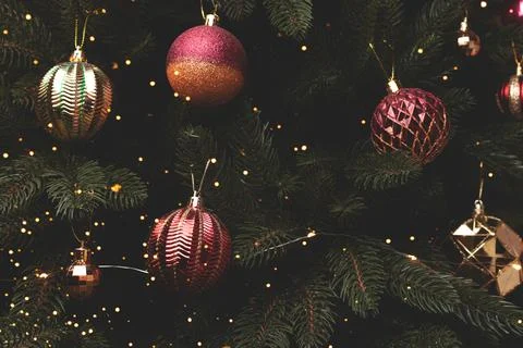 Fir tree with red and gold baubles. Stock Photos