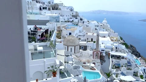 Fira city view with cafes, pools and hotels in Santorini island in Greece Stock Footage 147557338