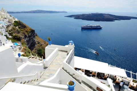 Fira, greece - may 17: the view on fira town and tourists enjoying their vaca Stock Photos