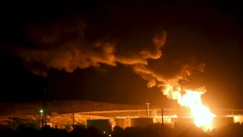 Fire after an explosion at night Stock Footage 99339937