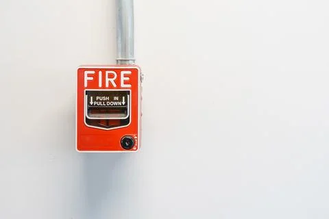Fire alarm box on cement wall for warning and security system Stock Photos