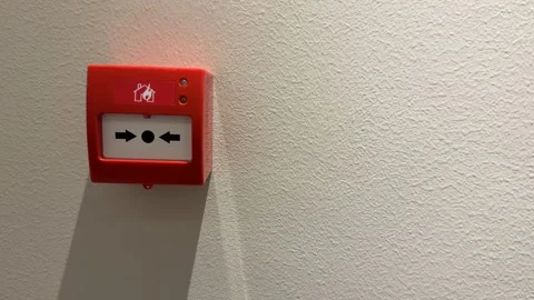 Fire alarm button on wall casting shadow, emergency equipment concept, usab.. Stock Footage 323714374