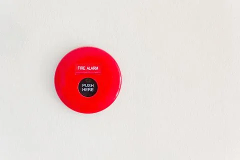 Fire alarm mounted on cement wall for warning and security system Stock Photos