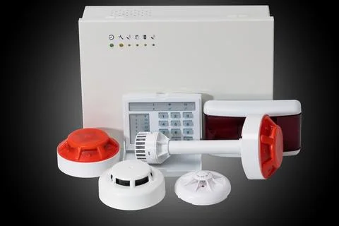 Fire alarm system on a dark background. fire safety for home. Stock Photos