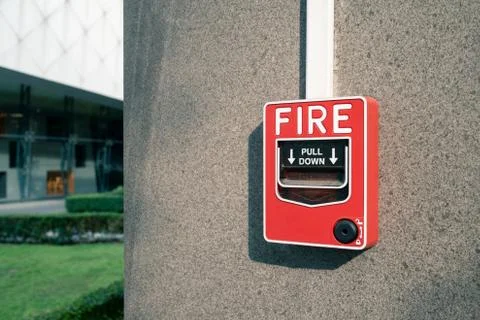 Fire alarm system on wall at open air shopping plaza Stock Photos