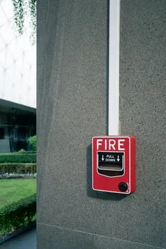Fire alarm system on wall at open air shopping plaza Stock Photos