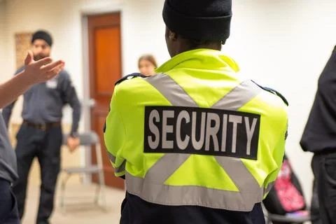 Fire Alarm training class by security guard in office Stock Photos