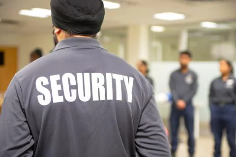 Fire Alarm training class by security guard in office Stock Photos