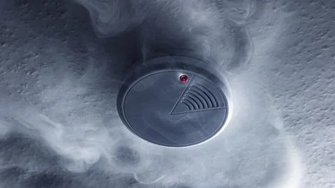 Fire alarm will be triggered with a smoke detector Stock Photos