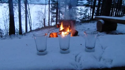 Fire and on the back 3 empty glases for vodka. Stock Footage 56005046