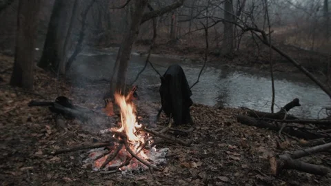 Fire and Campsite by River in the Forest Stock Footage 86220365
