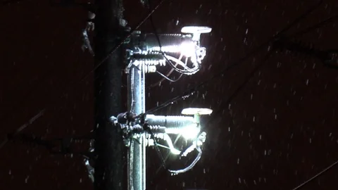 Fire and electrical explosions in ice wind snow and freezing rain storm Stock Footage 102822995