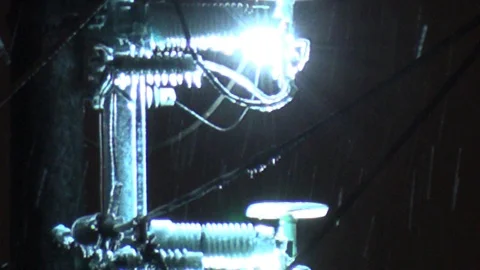 Fire and electrical explosions on power lines in storm Stock Footage 102827900