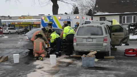 Fire and EMS Extricating Trapped Patient In Crash 스톡 동영상 35698092