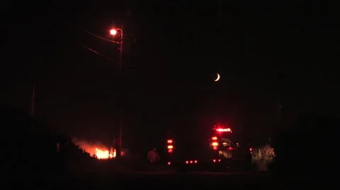 Fire and Firetruck under Crescent Moon Video stock 7739740
