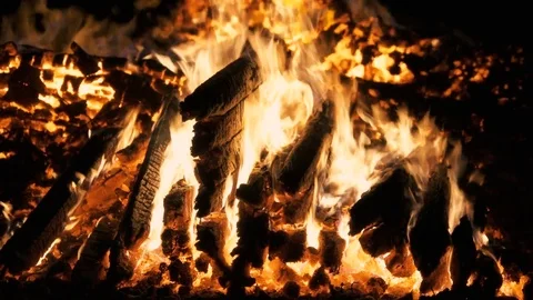 Fire and flames of a bonfire with pieces of wood burning in the night Stock Footage 72480080