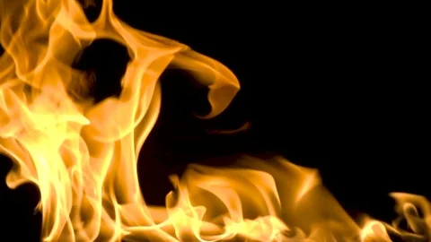 Fire and flames burning on a reflective glass surface, in slow motion with a Stock Footage 82753118