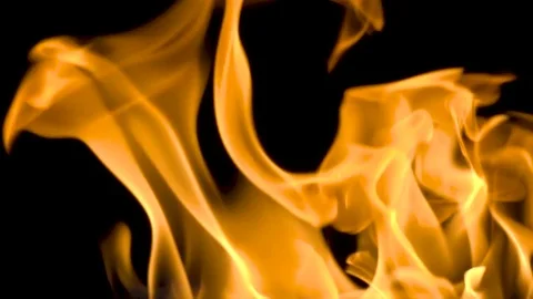 Fire and flames burning on a reflective glass surface, in slow motion with a Stock Footage 82753844