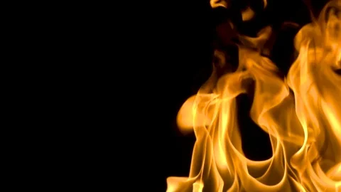Fire and flames burning on a reflective glass surface, in slow motion with a Stock Footage 82754047